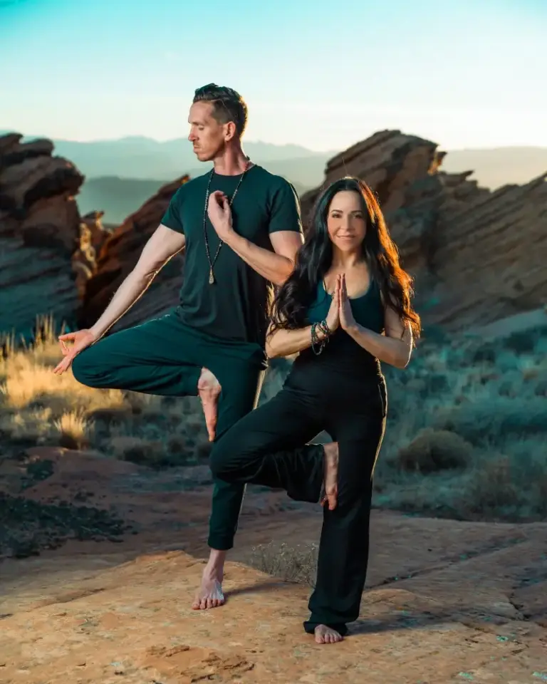 Founders of FeelLove Coffee and Be Hot Yoga in St. George, Utah practicing yoga in Southern Utah desert near red rock formations